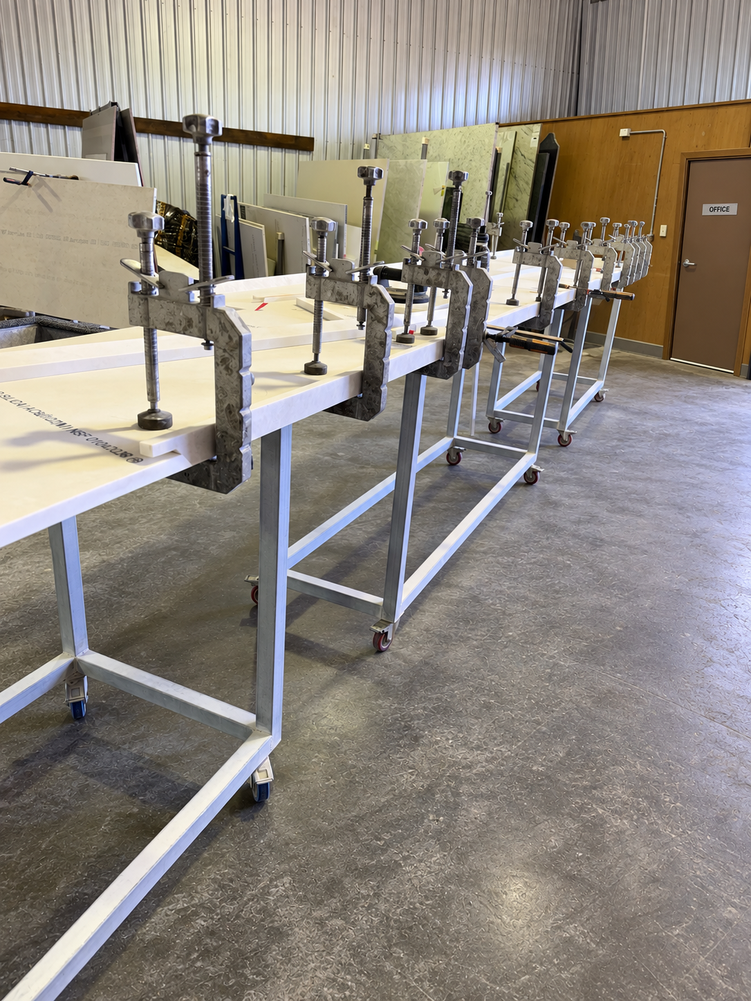 Original Arctic Stone workshop photograph of mitre clamps on stone workpieces